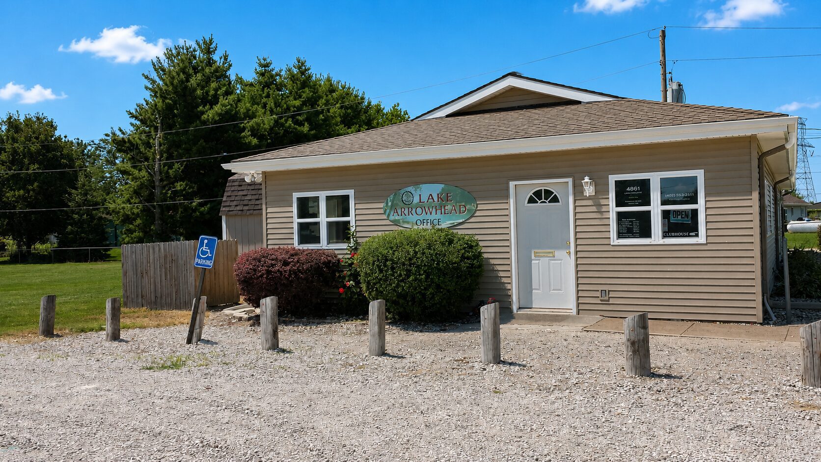 Small office building with gravel parking lot.