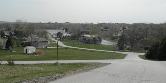 Suburban landscape with houses and roads visible.