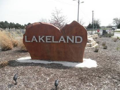 Lakeland sign on large rock formation.